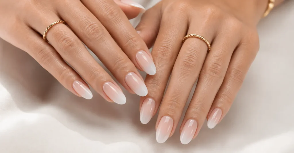 Nude Nails: The Timeless Elegance Every Woman Deserves 4 Milky Ombré Nude Nails with a soft gradient manicure