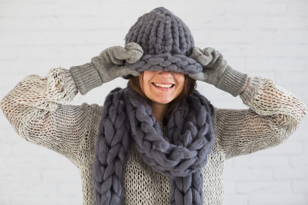 smiling lady mittens scarf hat eyes
