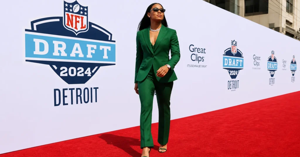NFL draft viral outfit female athlete wearing bold emerald green suit with luxury accessories