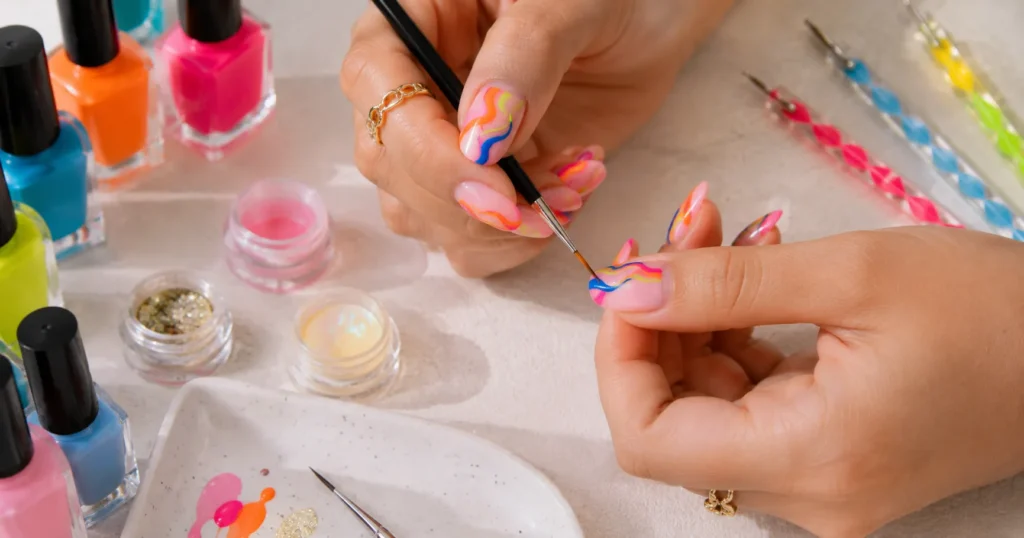 The Complete Guide to Colorful Nail Designs in 2026 11 Colorful nail designs with DIY nail art tools and creative manicure setup