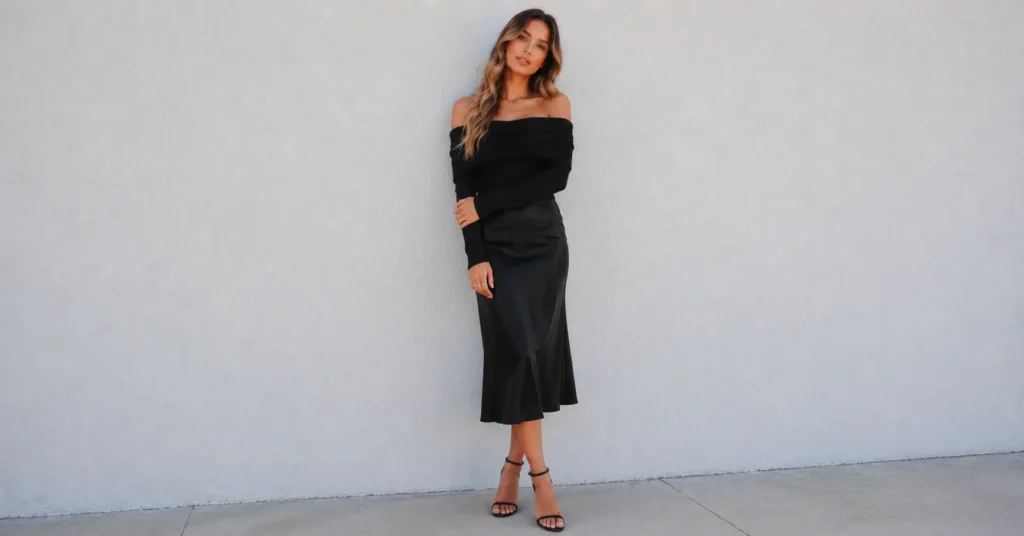 The Complete Guide to Black Skirt Outfit Ideas for Any Occasion 6 Black skirt outfit ideas featuring a romantic satin midi skirt for date night fashion.