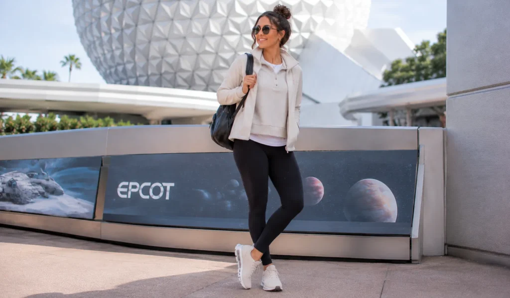 Layered winter epcot outfit ideas with leggings and lightweight jacket.