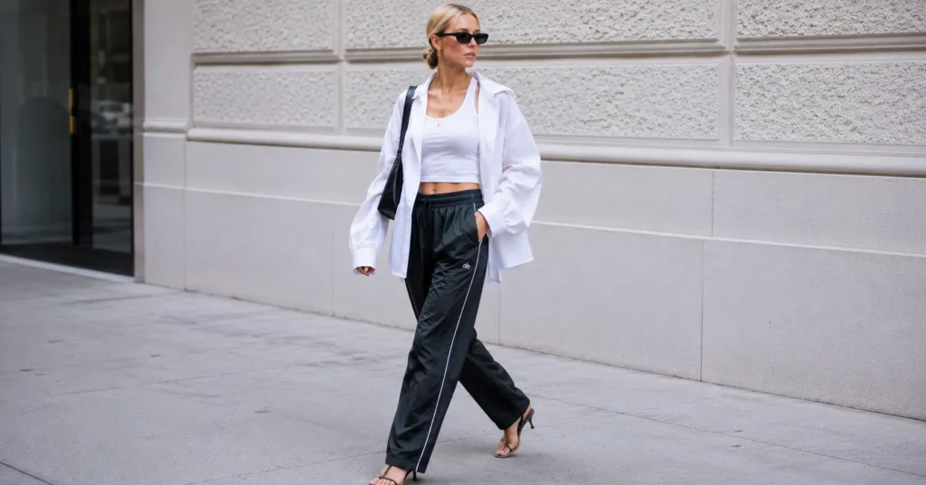 The Guide to the Elsa Hosk Track Pants Outfit: Street Style Elevated 8 Elsa Hosk track pants outfit with nylon track pants and oversized shirt