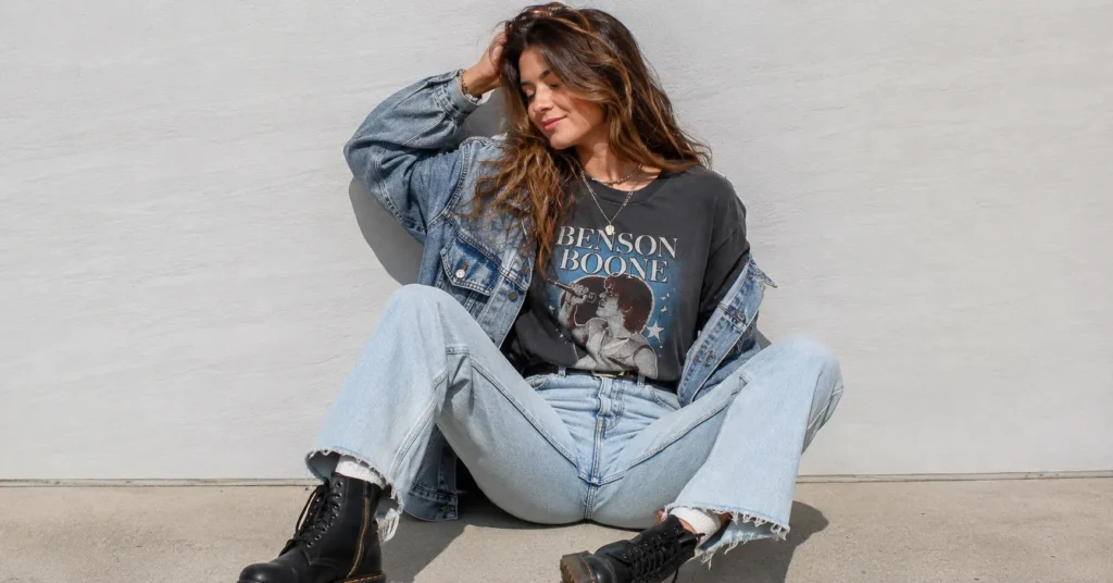 Benson Boone Concert Outfit Ideas: Looks to Match Every Vibe and Venue 2 Benson Boone concert outfit ideas featuring a graphic tee, vintage denim, chunky boots, and layered jewelry.