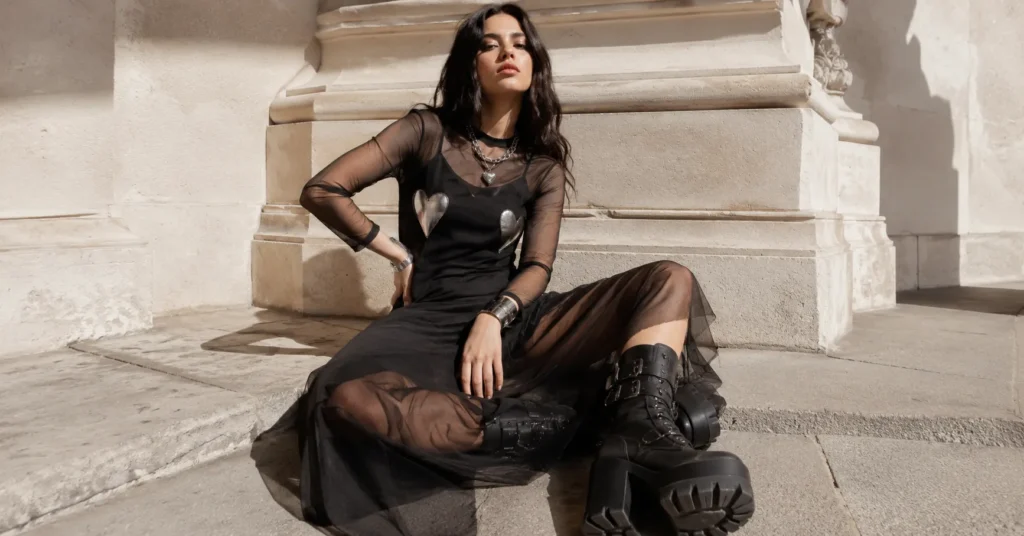 Chrome heart dress outfit with mesh layered dress, platform boots, and silver accessories.