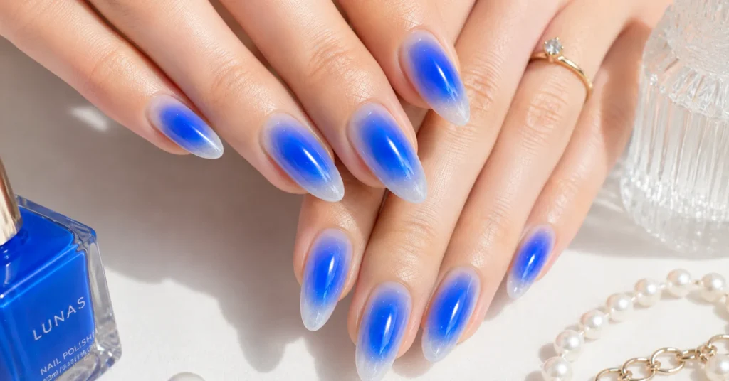 Aura Nails Ideas: 30 Dreamy Designs to Glow With in 2026 7 Aura Nails Ideas featuring a vibrant electric blue aura manicure
