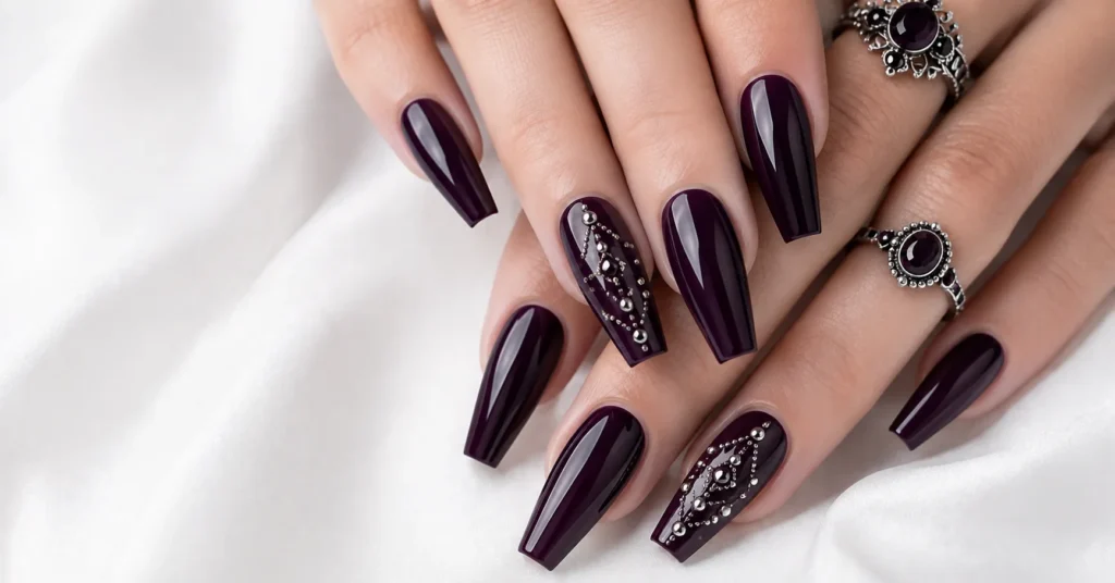 12 Bewitching Gothic Coffin Nails Ideas for a Dark and Glamorous Manicure 9 Gothic Coffin Nails Ideas with Deep Plum and Silver Studs